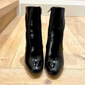Stunning paten black mid rise boots. Barely worn size 7.5. Perfect condition!